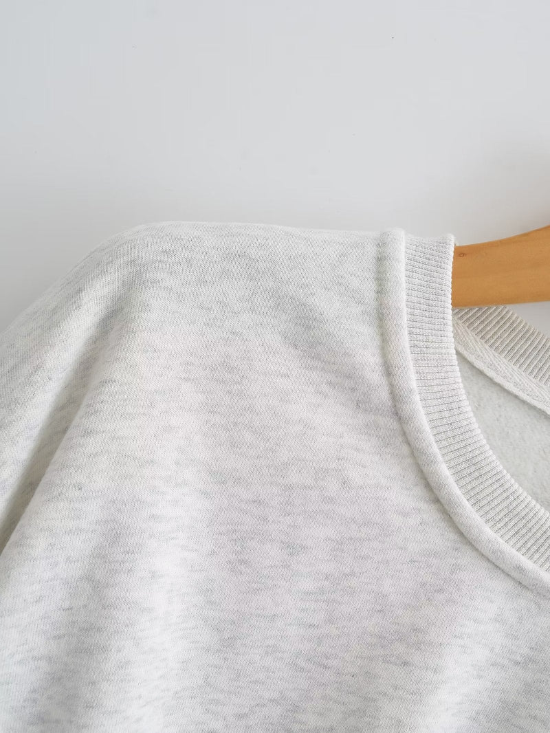 A Vintage Style Sweater with Delicate Timeless Details